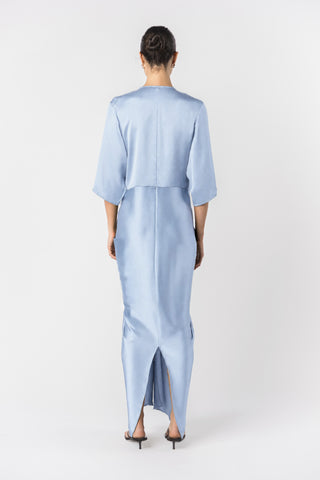 Back view of a Model wearing the Signature Alex Kimono maxi dress in princess blue satin.