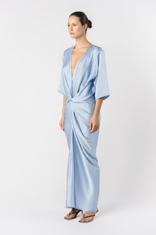Model wearing the Signature Alex Kimono maxi dress in princess blue satin. Side view detailing 3/4 length sleeve 