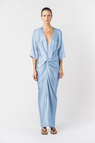 Model wearing the Signature Alex Kimono maxi dress in princess blue satin. Front facing shot with twist detail atr waist