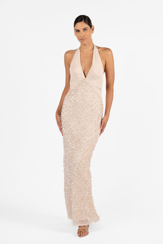 Cloe Halter Maxi in Concha Sand, featuring a plunging halter neckline, fitted silhouette and embellished sequin maxi skirt.