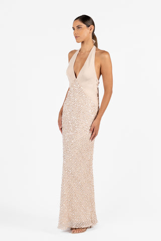 Cloe Halter Maxi in Concha Sand shown from the side, featuring a deep V neckline, halter straps and intricate sequin embellishment.
