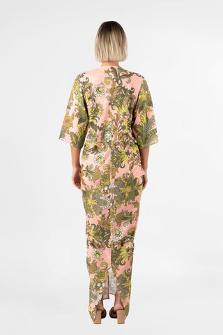 One Fell Swoop Alex Kimono in Jardin de Soie, back view showing the high round back neckline, the wide kimono sleeves falling to the elbow and the smooth back of the dress in the pink, olive and chartreuse baroque botanical print.