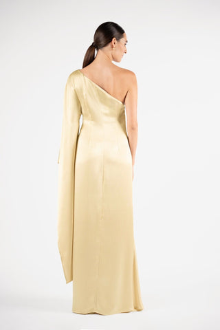 One Fell Swoop Arc Maxi in Dune, back view showing the clean back and cascading sleeve, pale gold satin one shoulder gown.