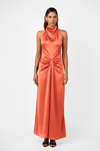  One Fell Swoop Caira Gown in Clay with a soft cowl halter neckline, gathered waist detail and fluid satin maxi dress. 