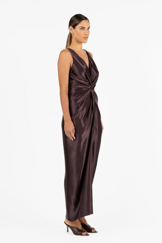 Side view of the One Fell Swoop Galia Maxi in Aubergine featuring sculptural draping, satin finish and full length silhouette. 