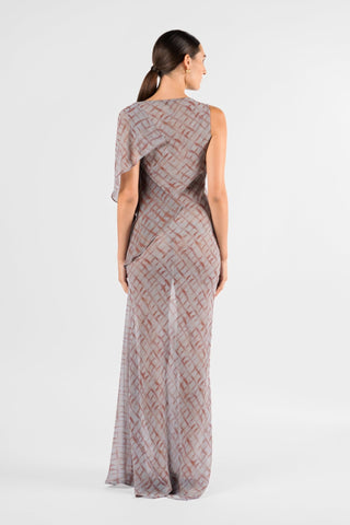 One Fell Swoop Glinch Gown in Ink Veil, back view of the sheer printed chiffon gown, showing a round back neckline, the draped panel falling over one shoulder at the back, the fitted waist and a long skirt that widens gently to the floor.